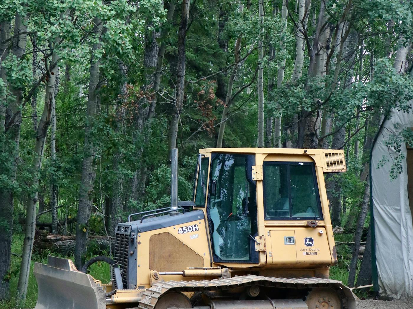 Heavy equipment clearing land for site preparation in DFW